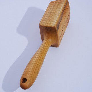 Kitchen pestle made of one piece of Cherry wood